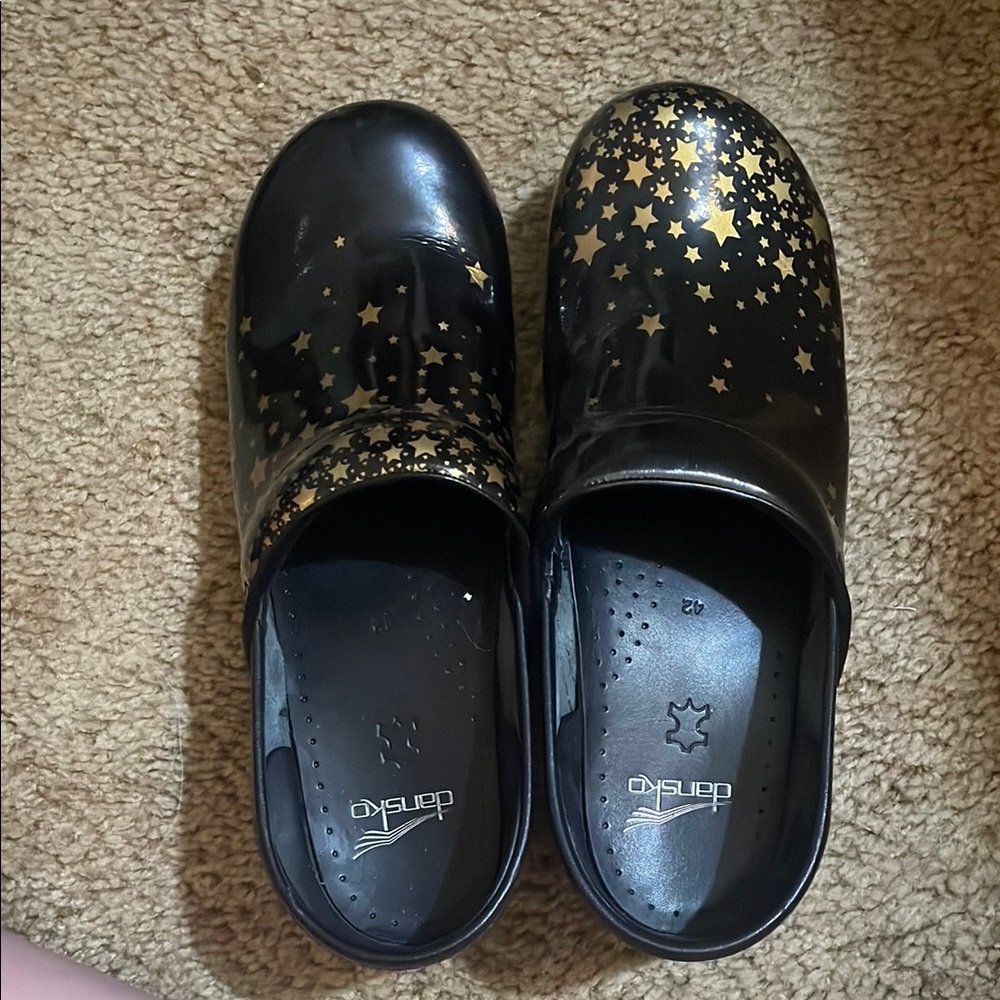 Dansko Women’s Black and Gold Star Clogs